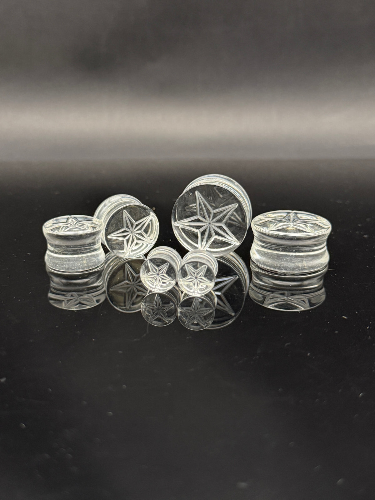 Double Flare Clear Acrylic Plugs with Embossed Star
